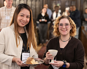 Charmaine Narvadez (left) and Lijah Medina offer Holy Communion on Oct. 23 during the United Methodist Leadership Gathering at Knox United Church in Calgary, Canada. Photo by Mike DuBose, UM News.